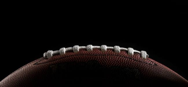 American football on black background