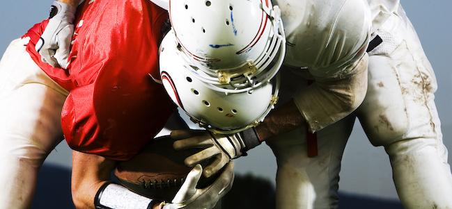 American football player in tackle