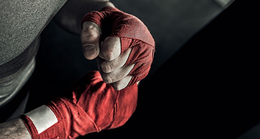 Fighter wrapping red bandage