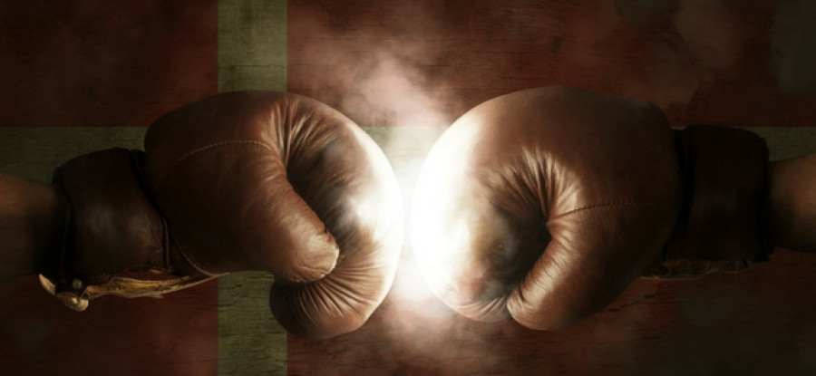 Boxing gloves in front of Denmark flag