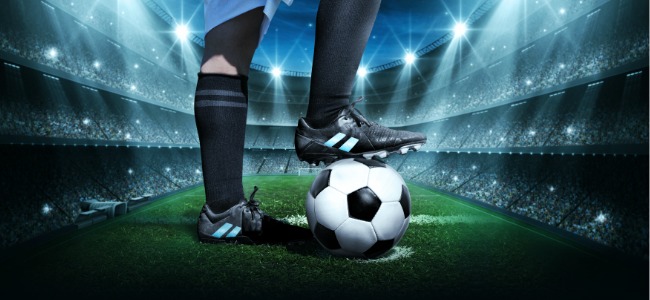 Foot_on_Football_In_Stadium