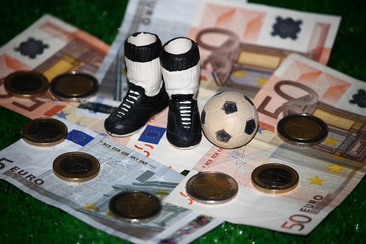 Football boots on money