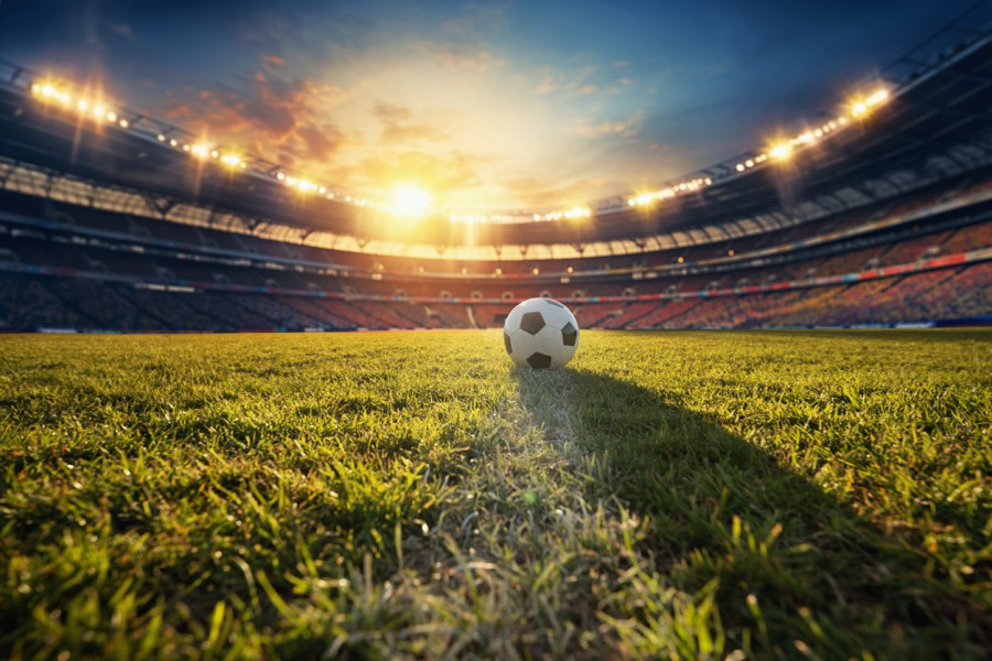 Football on grass in a football stadium