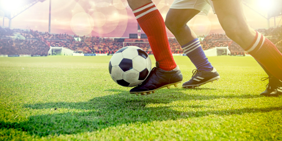 Football players on field with ball