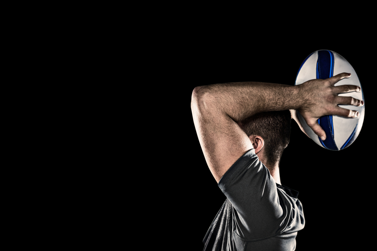 Rugby player on black background