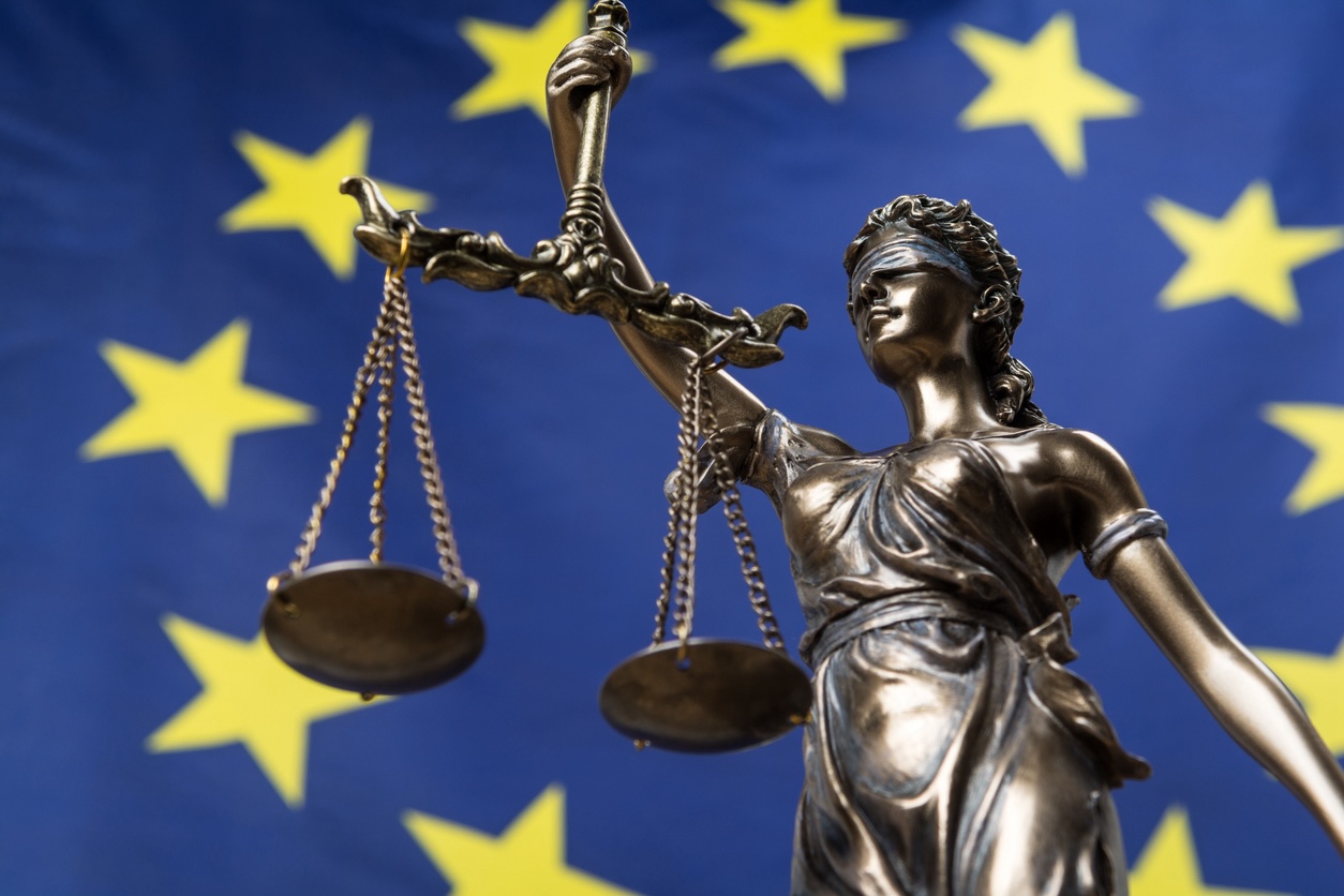 scales of justice against EU flag