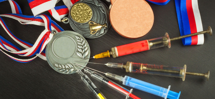 Syringes in medals on desk