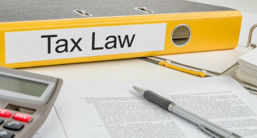 Tax_Law_on_Yellow_folder_with_paperwork