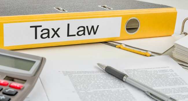 Tax_Law_on_Yellow_folder_with_paperwork