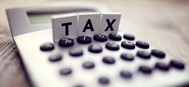 Tax spelled out in block letters on top of calculator