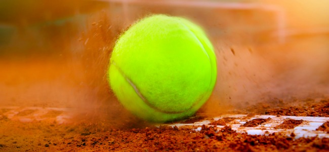 Tennis Ball hitting the dirt