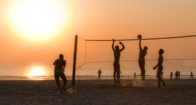 Volleyball_being_played_on_Beach_at_Sunset