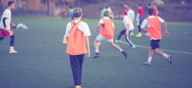 Young footballers training on field