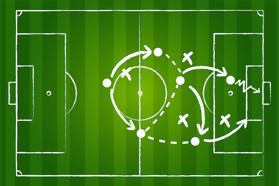 Image of football strategy drawn on pitch