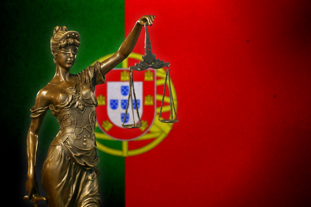 Lady Justice In Front of Portuguese Flag