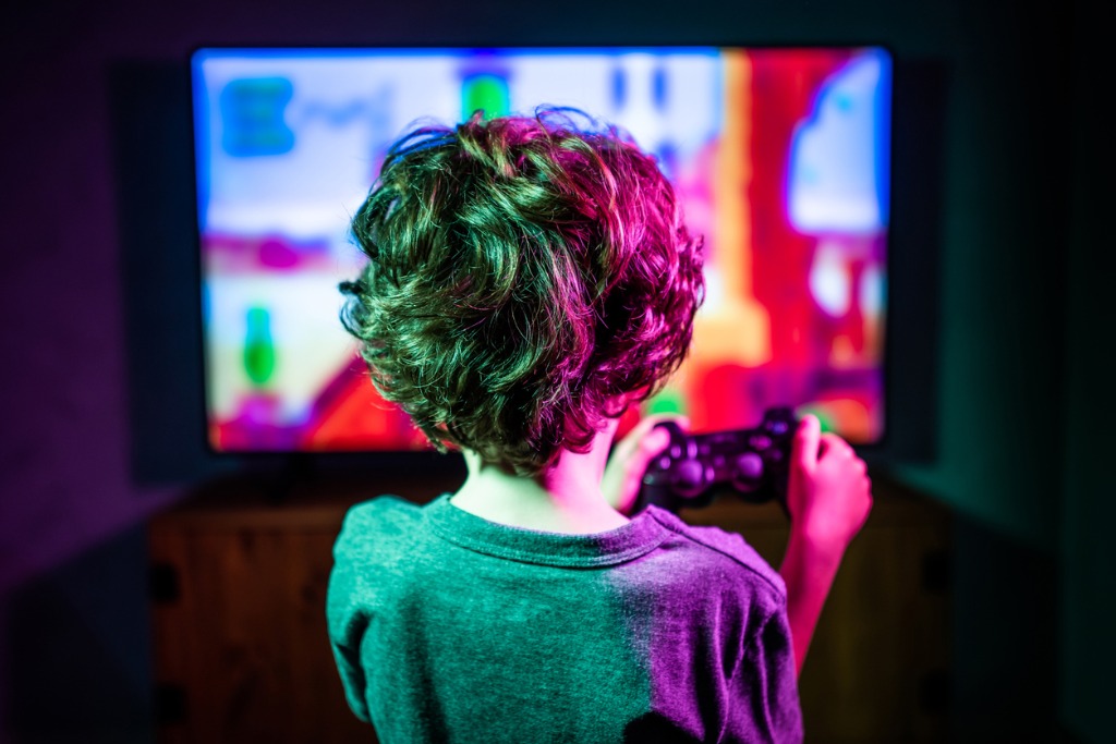 Little boy playing video game