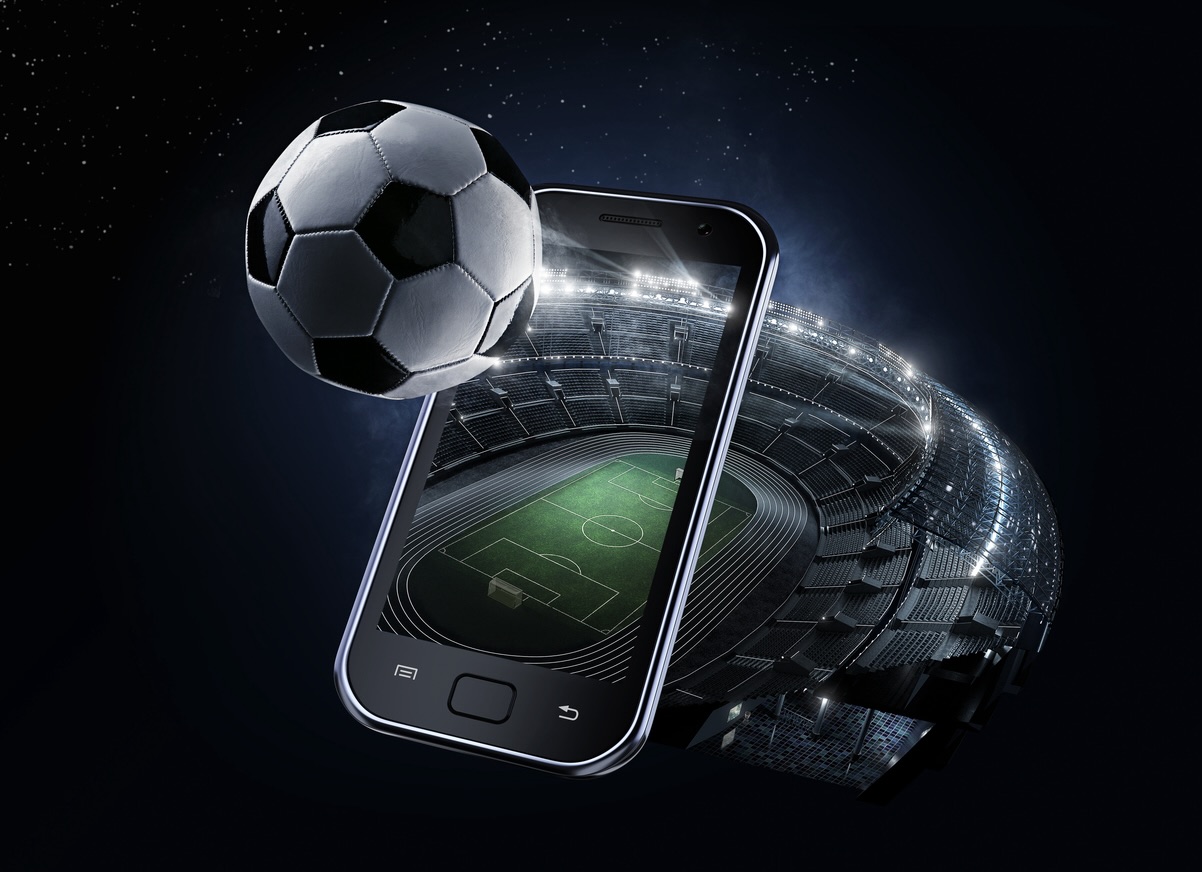 Mobile phone with football popping out of screen