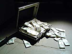 Money falling out of briefcase