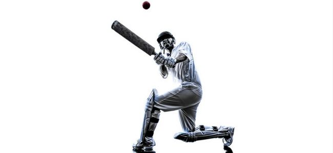 Cricket player hitting ball